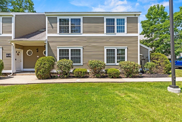 161 Saco Ave Unit 404, Old Orchard Beach, ME 04064 - view of front facade with a front yard