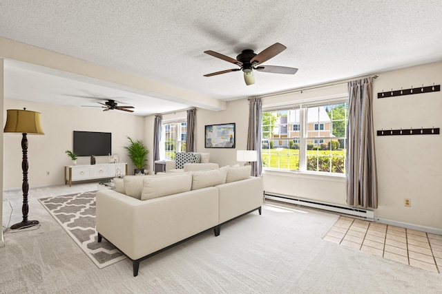 161 Saco Ave Unit 404, Old Orchard Beach, ME 04064 - living area with a baseboard radiator, a ceiling fan, carpet flooring, a textured ceiling, and tile patterned flooring