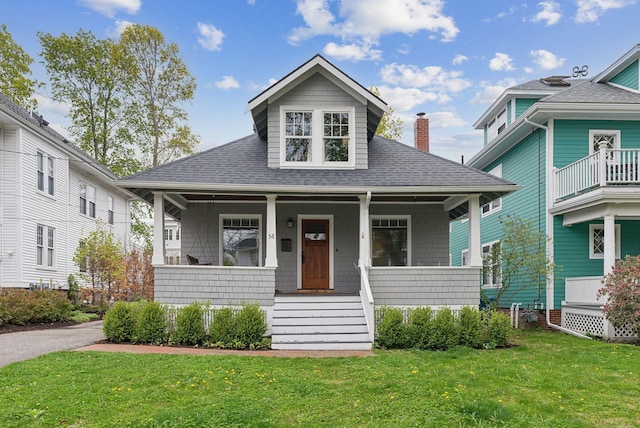 14 Codman St, Portland, ME 04103 - view of front facade with a porch, a shingled roof, a front yard, and a chimney