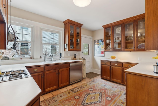 14 Codman St, Portland, ME 04103 - kitchen featuring a sink, stainless steel dishwasher, plenty of natural light, and light tile patterned floors