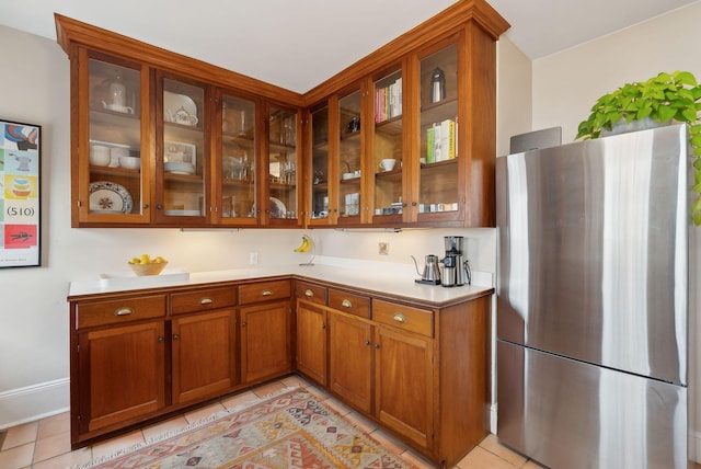 14 Codman St, Portland, ME 04103 - bar area featuring freestanding refrigerator, light tile patterned floors, and baseboards