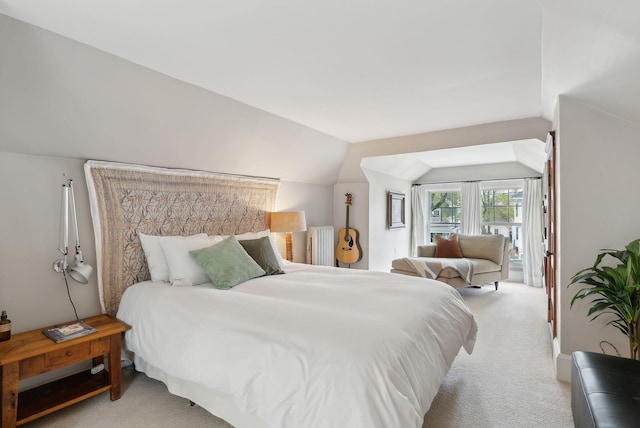 14 Codman St, Portland, ME 04103 - bedroom with access to outside, light carpet, vaulted ceiling, and radiator heating unit