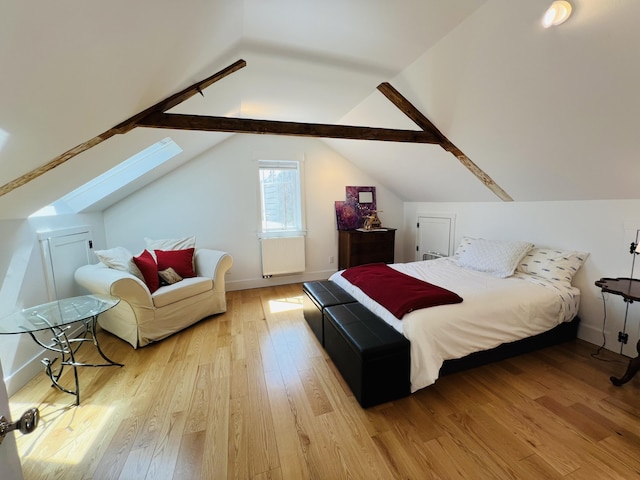 157 Ellsworth Rd, Blue Hill, ME 04614 - bedroom featuring a skylight, light wood-style flooring, and lofted ceiling