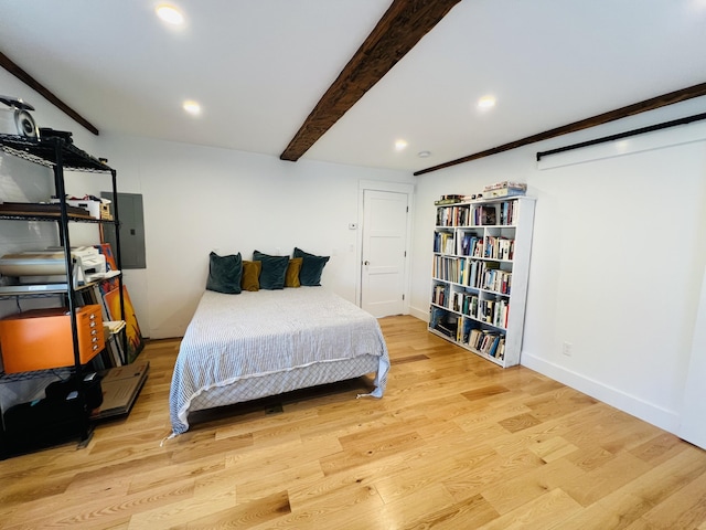 157 Ellsworth Rd, Blue Hill, ME 04614 - bedroom featuring beam ceiling, electric panel, wood finished floors, and recessed lighting