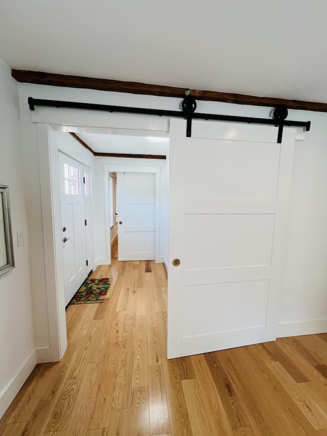 157 Ellsworth Rd, Blue Hill, ME 04614 - foyer with light wood-style floors and a barn door