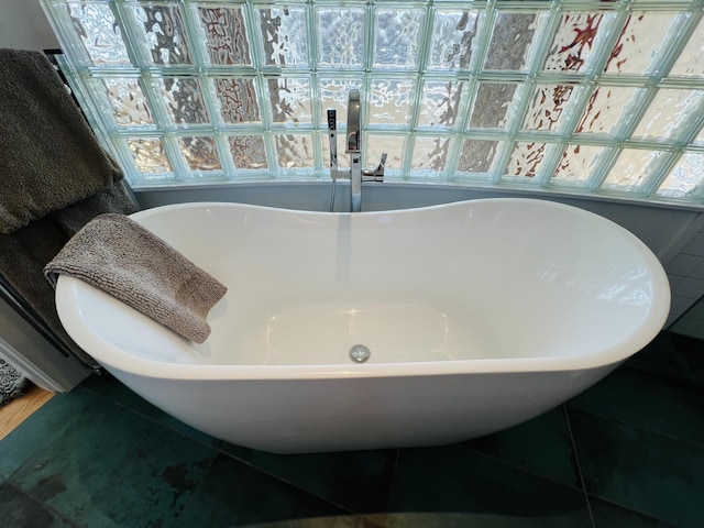 157 Ellsworth Rd, Blue Hill, ME 04614 - full bath with a soaking tub and tile patterned floors
