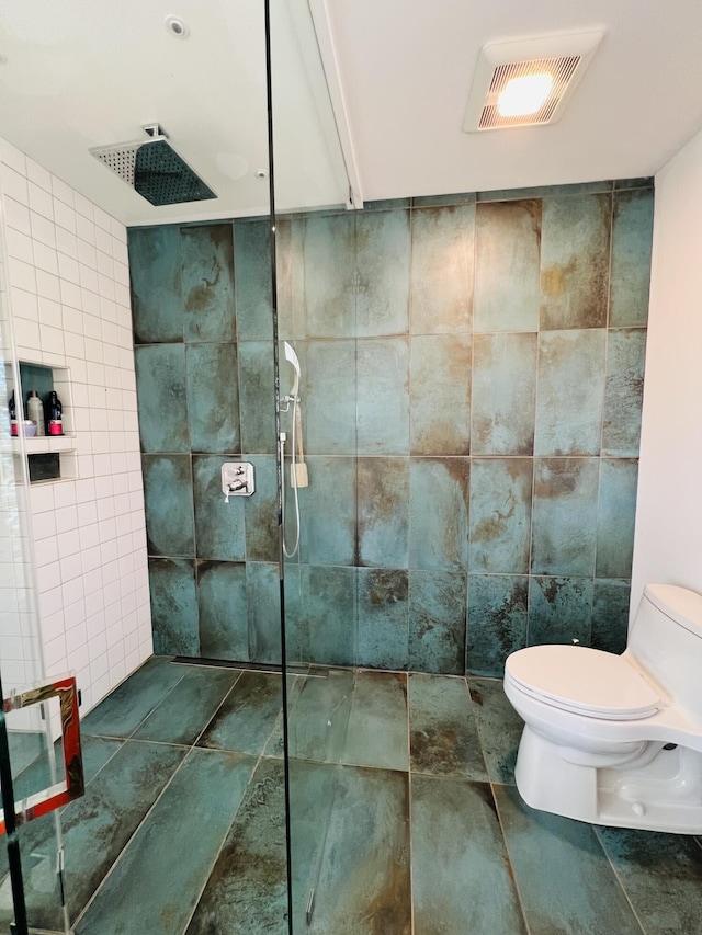 157 Ellsworth Rd, Blue Hill, ME 04614 - bathroom featuring tile walls and a tile shower
