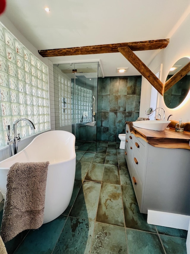 157 Ellsworth Rd, Blue Hill, ME 04614 - full bath with tile walls, vanity, a stall shower, and a freestanding bath