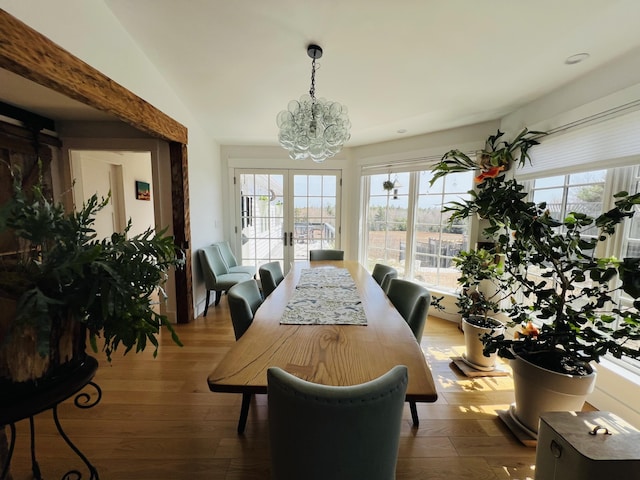 157 Ellsworth Rd, Blue Hill, ME 04614 - dining space with a chandelier, plenty of natural light, and wood finished floors
