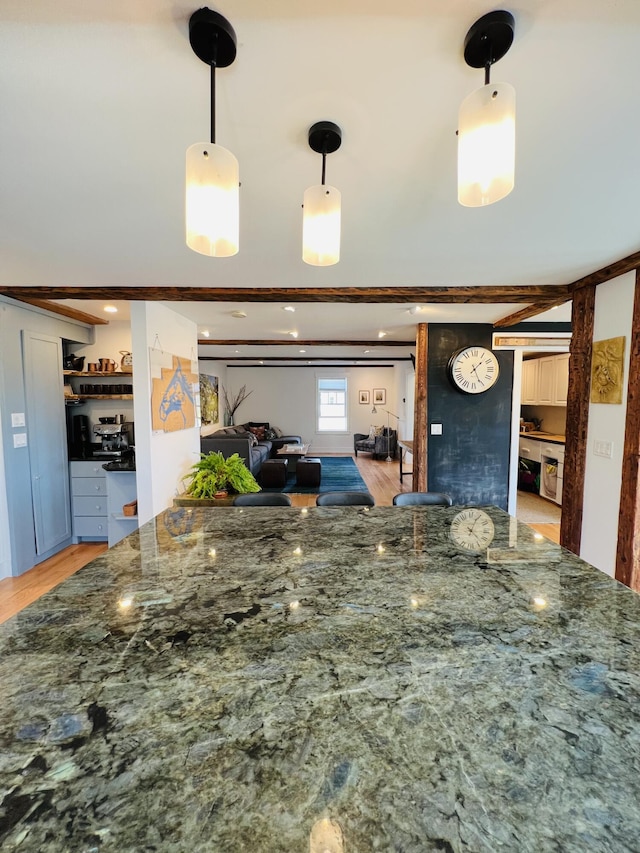 157 Ellsworth Rd, Blue Hill, ME 04614 - kitchen featuring dark stone counters, light wood finished floors, decorative light fixtures, and open floor plan