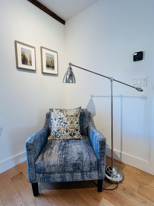 157 Ellsworth Rd, Blue Hill, ME 04614 - sitting room with wood finished floors and beam ceiling