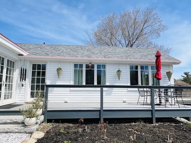 157 Ellsworth Rd, Blue Hill, ME 04614 - back of property featuring a deck, a shingled roof, and french doors