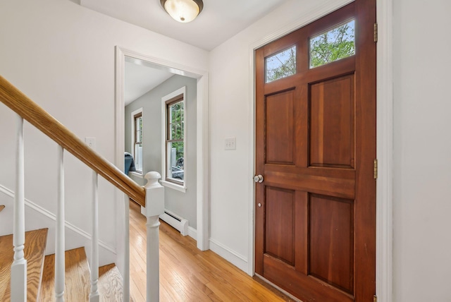 26 Hunts Point Rd, Cape Elizabeth, ME 04107 - entryway with a baseboard radiator, light wood finished floors, stairs, and baseboards