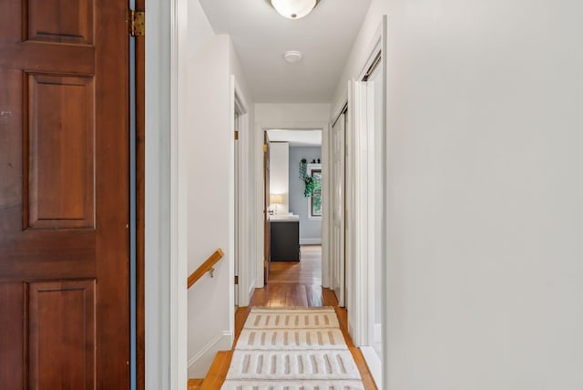 26 Hunts Point Rd, Cape Elizabeth, ME 04107 - corridor featuring baseboards and light wood-style floors