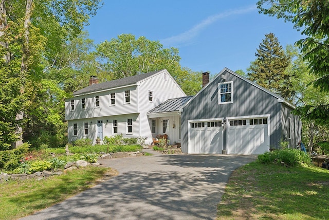 26 Hunts Point Rd, Cape Elizabeth, ME 04107 - colonial inspired home with a chimney and asphalt driveway