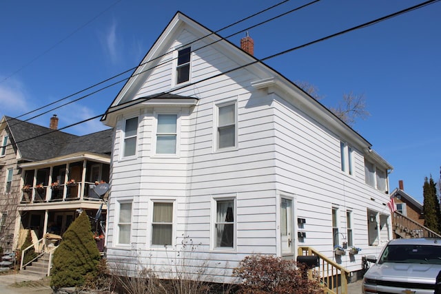 13 Halde St, Waterville, ME 04901 - view of side of home featuring a chimney