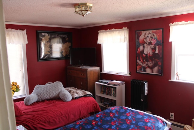 13 Halde St, Waterville, ME 04901 - bedroom featuring radiator heating unit, multiple windows, crown molding, and a textured ceiling