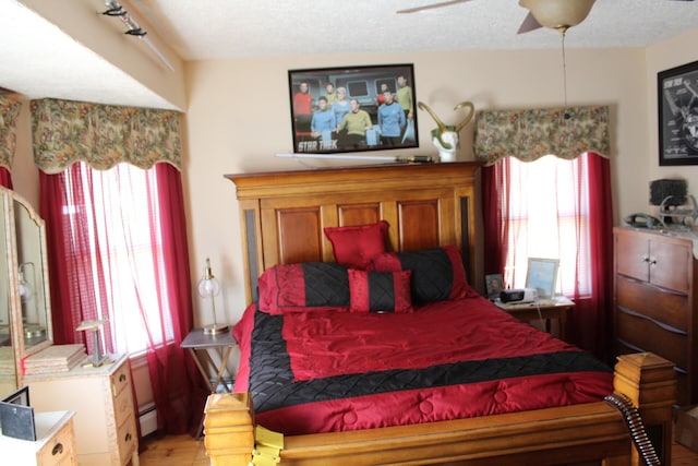 13 Halde St, Waterville, ME 04901 - bedroom with a textured ceiling, light wood finished floors, and a ceiling fan