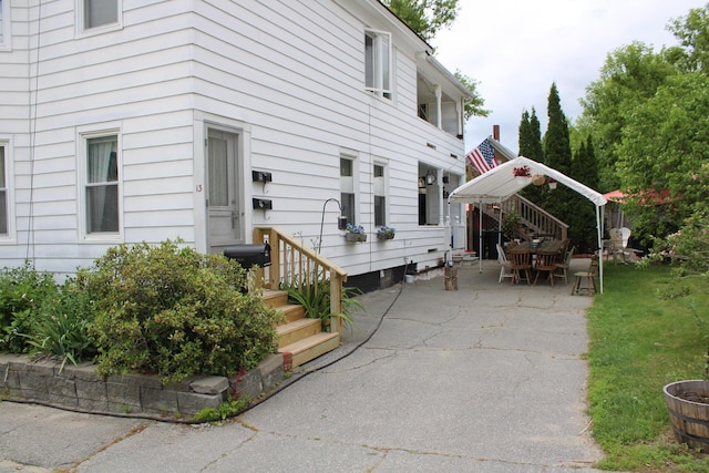 13 Halde St, Waterville, ME 04901 - view of property exterior featuring a patio