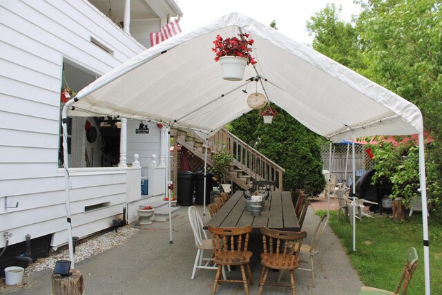 13 Halde St, Waterville, ME 04901 - view of patio with stairway and outdoor dining area