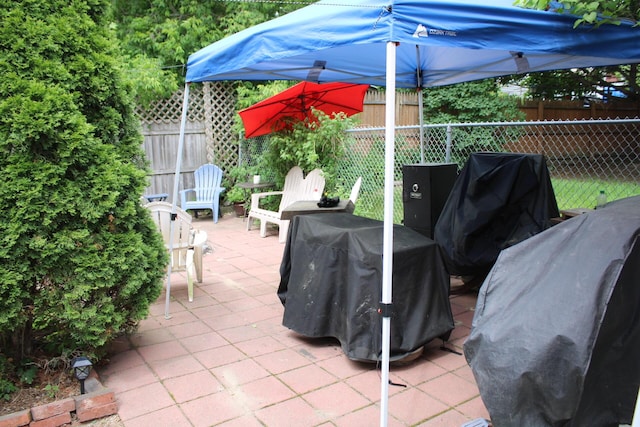 13 Halde St, Waterville, ME 04901 - fenced backyard featuring a patio and area for grilling