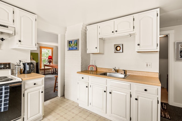 47 Bay View St, Camden, ME 04843 - kitchen featuring electric range, a sink, under cabinet range hood, and white cabinets