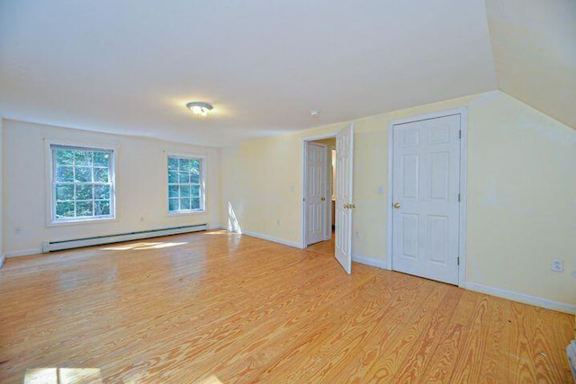 16 Dragonfly Ln, Kennebunkport, ME 04046 - unfurnished room featuring a baseboard heating unit, light wood finished floors, baseboards, and vaulted ceiling