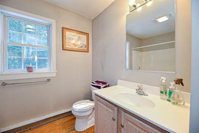 16 Dragonfly Ln, Kennebunkport, ME 04046 - full bathroom with plenty of natural light, vanity, wood finished floors, and toilet