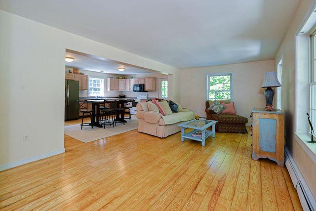16 Dragonfly Ln, Kennebunkport, ME 04046 - living room featuring light wood-style floors and baseboard heating