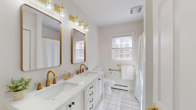 12 Summit Ter, Falmouth, ME 04105 - bathroom with a sink, tile patterned floors, baseboard heating, and visible vents
