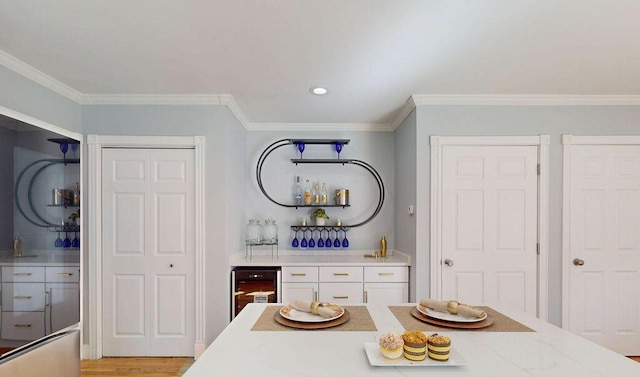 12 Summit Ter, Falmouth, ME 04105 - dining room with crown molding, recessed lighting, wet bar, and wine cooler