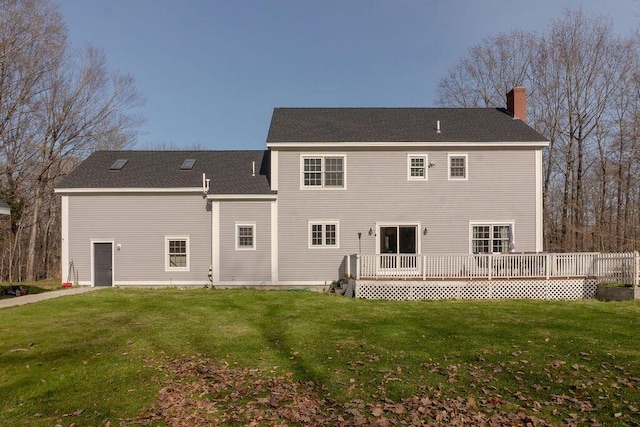 12 Summit Ter, Falmouth, ME 04105 - back of property featuring a wooden deck, a chimney, and a yard