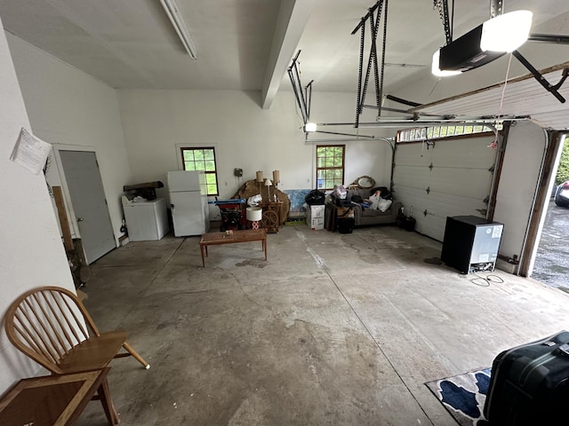 12 Summit Ter, Falmouth, ME 04105 - garage with a garage door opener and freestanding refrigerator