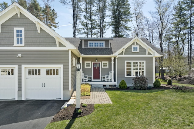 3 Flagship Cir, Kennebunk, ME 04043 - craftsman-style home featuring a porch, a front lawn, asphalt driveway, and roof with shingles