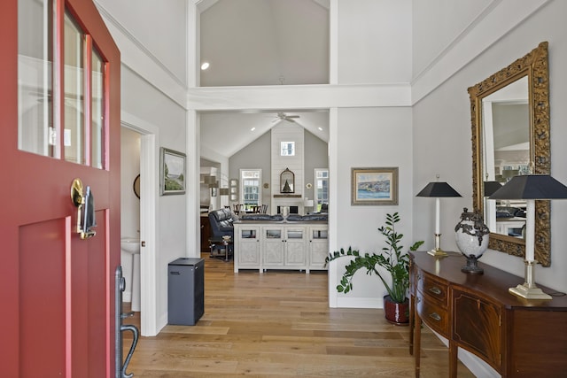 3 Flagship Cir, Kennebunk, ME 04043 - foyer featuring high vaulted ceiling, light wood finished floors, ceiling fan, and baseboards