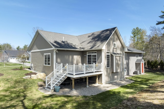 3 Flagship Cir, Kennebunk, ME 04043 - back of house featuring a wooden deck, a lawn, and roof with shingles