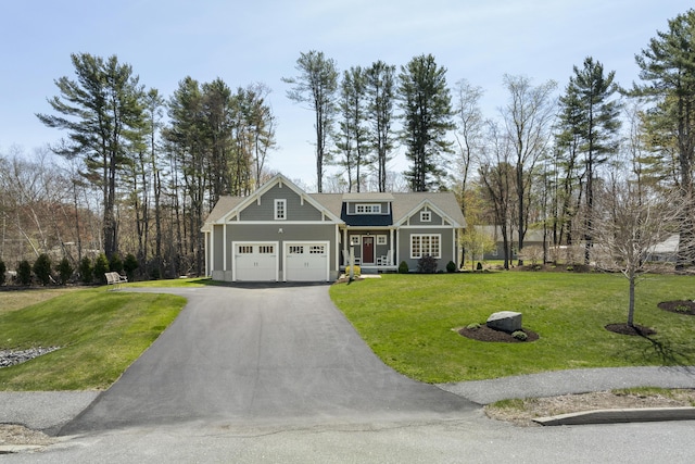 3 Flagship Cir, Kennebunk, ME 04043 - view of front of home with a garage, a front lawn, and driveway