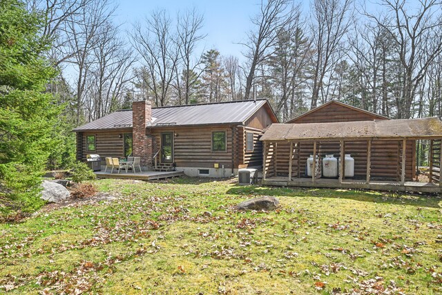 370 Point Rd, Belgrade, ME 04917 - rear view of house featuring a lawn, a deck, log exterior, and central AC unit