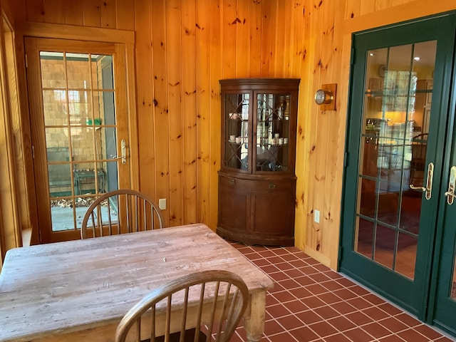 tiled dining area with wooden walls