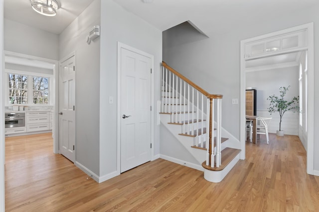 36 Fort Hill Ave, York, ME 03909 - stairs with baseboards, crown molding, and wood finished floors