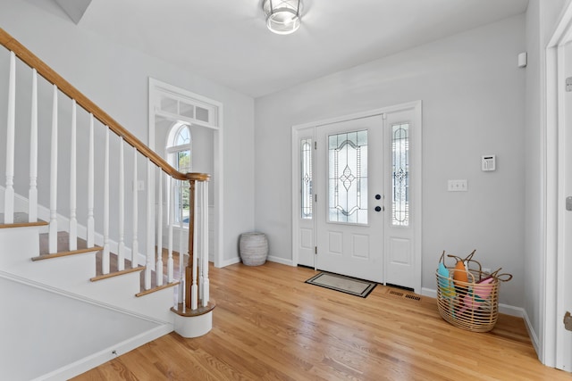 36 Fort Hill Ave, York, ME 03909 - entrance foyer with baseboards, stairs, wood finished floors, and visible vents