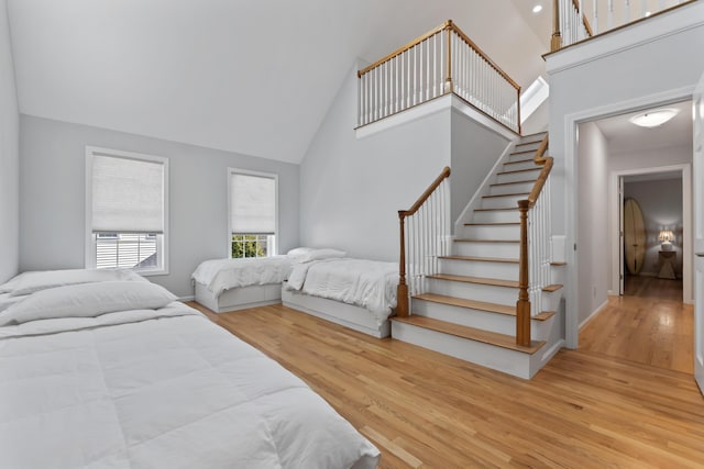 36 Fort Hill Ave, York, ME 03909 - bedroom with baseboards, high vaulted ceiling, and wood finished floors