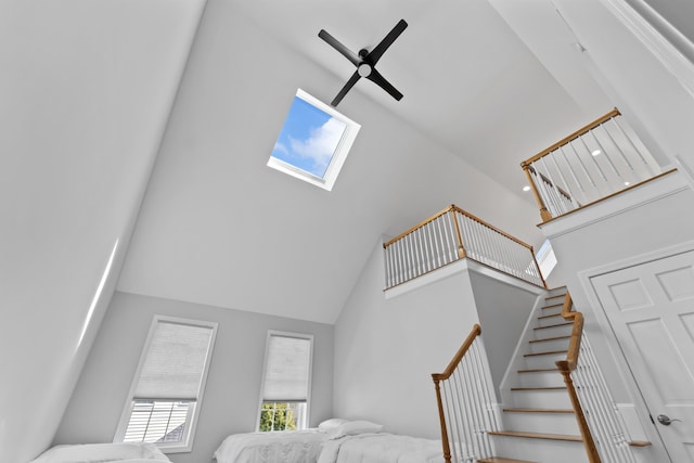 36 Fort Hill Ave, York, ME 03909 - staircase featuring a skylight and high vaulted ceiling