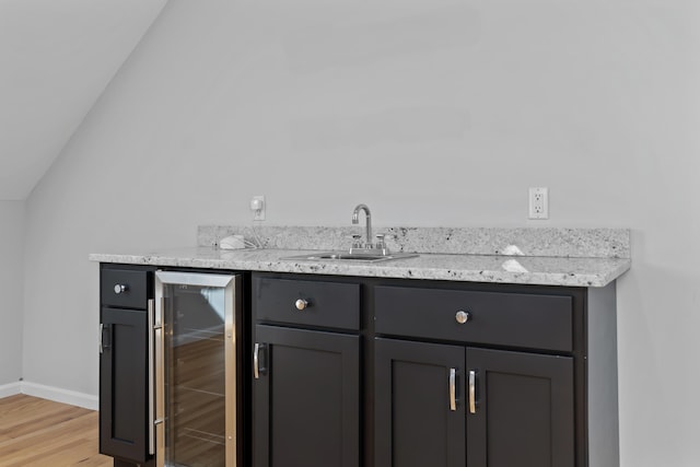 36 Fort Hill Ave, York, ME 03909 - bar featuring lofted ceiling, beverage cooler, baseboards, a sink, and light wood finished floors