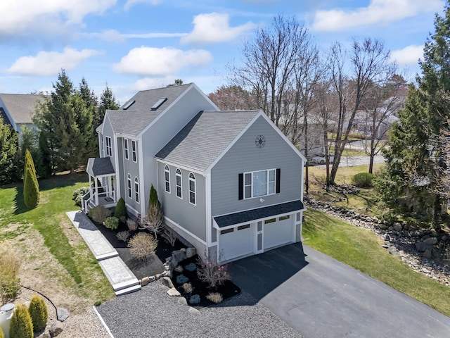 36 Fort Hill Ave, York, ME 03909 - view of property exterior featuring a garage, a shingled roof, a lawn, and driveway