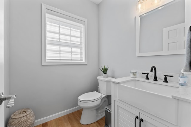 36 Fort Hill Ave, York, ME 03909 - bathroom featuring toilet, baseboards, wood finished floors, and vanity