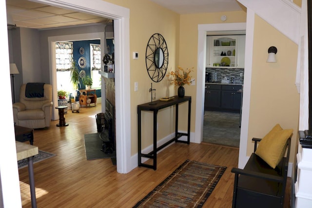 hall with wood finished floors