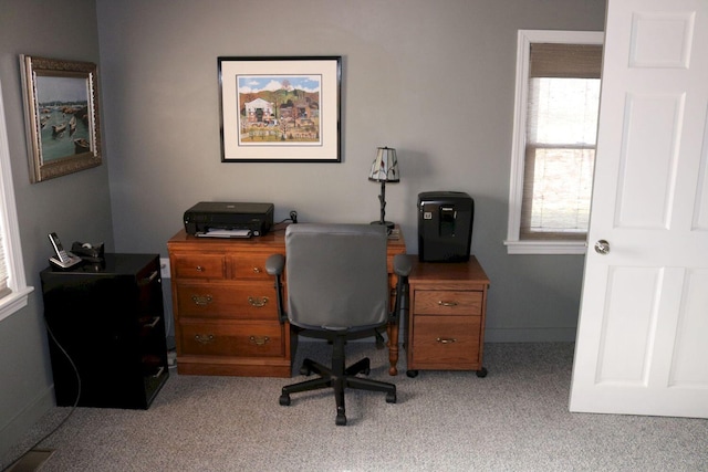 office area featuring baseboards and carpet flooring