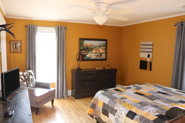 bedroom with ornamental molding, light wood finished floors, and ceiling fan