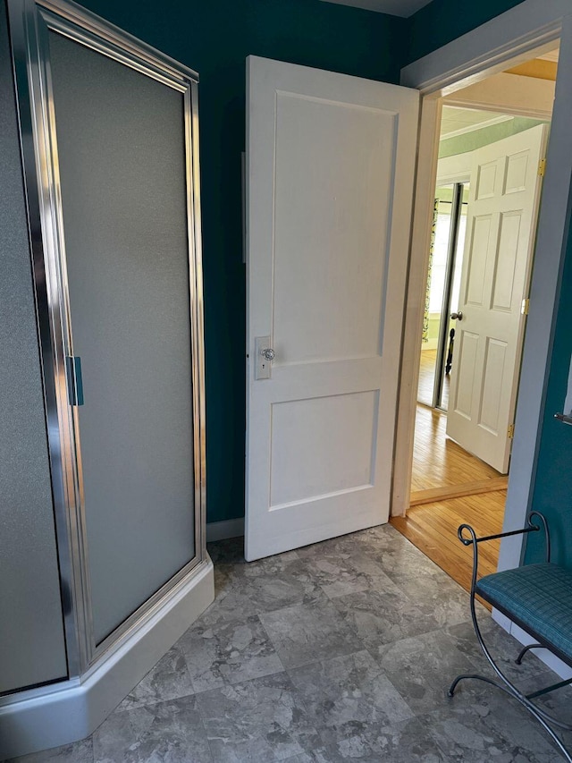 full bath with a shower stall